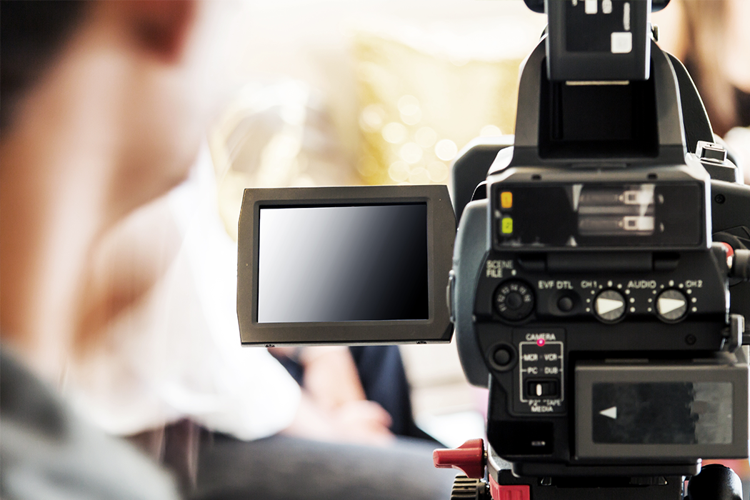 Back of a video camera with the background out of focus.