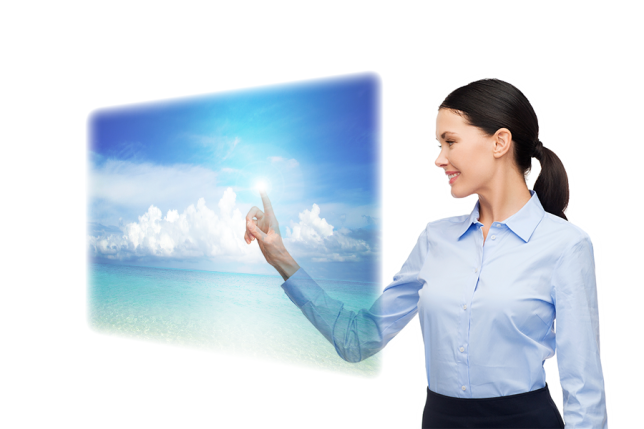 Smiling businesswoman interacts with a futuristic touchscreen.