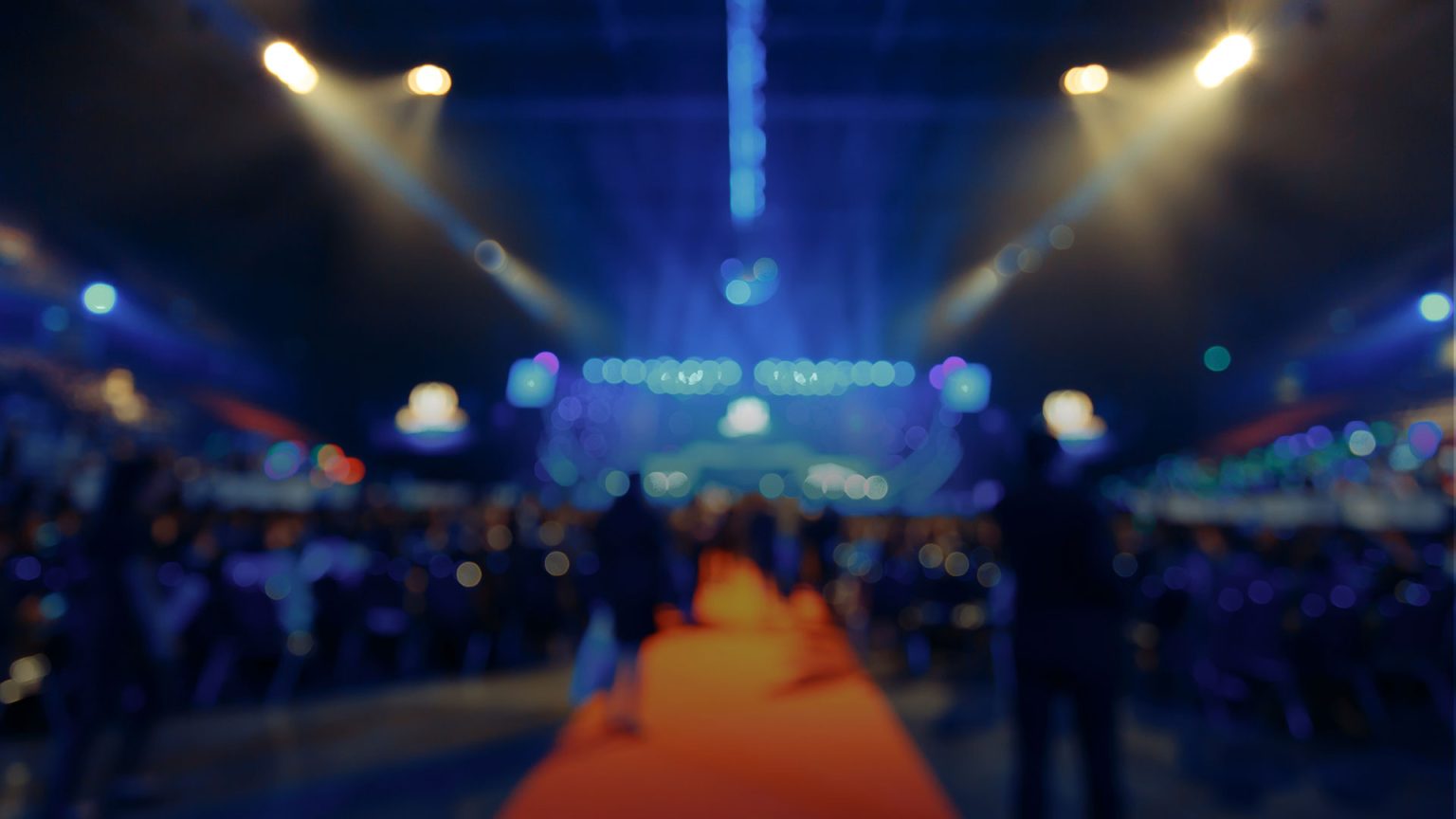 Soft focus, colorful entrance run for large scale event.